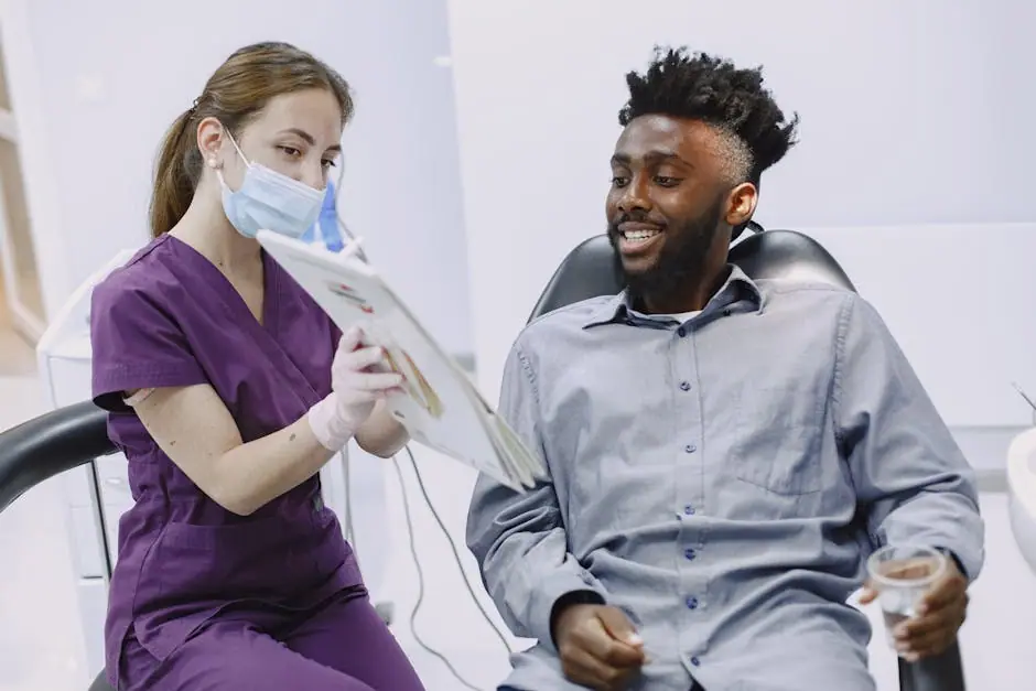 A dentist explains treatment options to a patient during a checkup.
