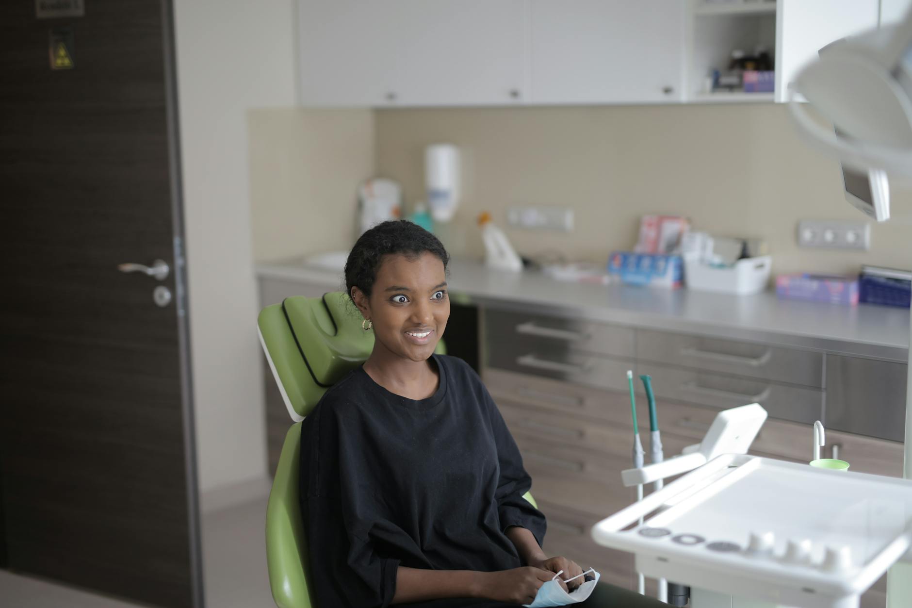 Patient smiling after successful dental implant treatment at Smile Dental Center