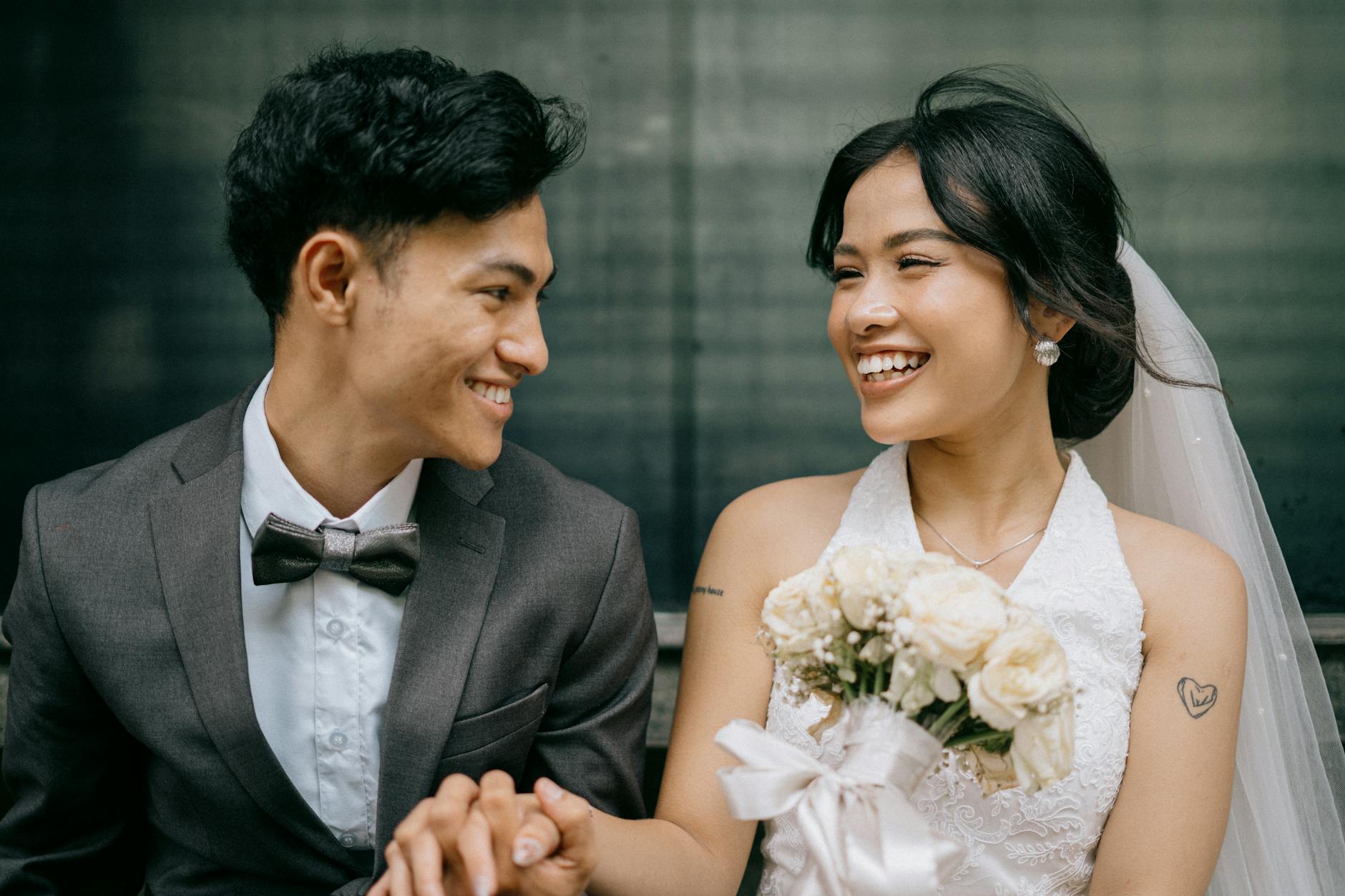 Wedding couple with confident bright smiles on their special day
